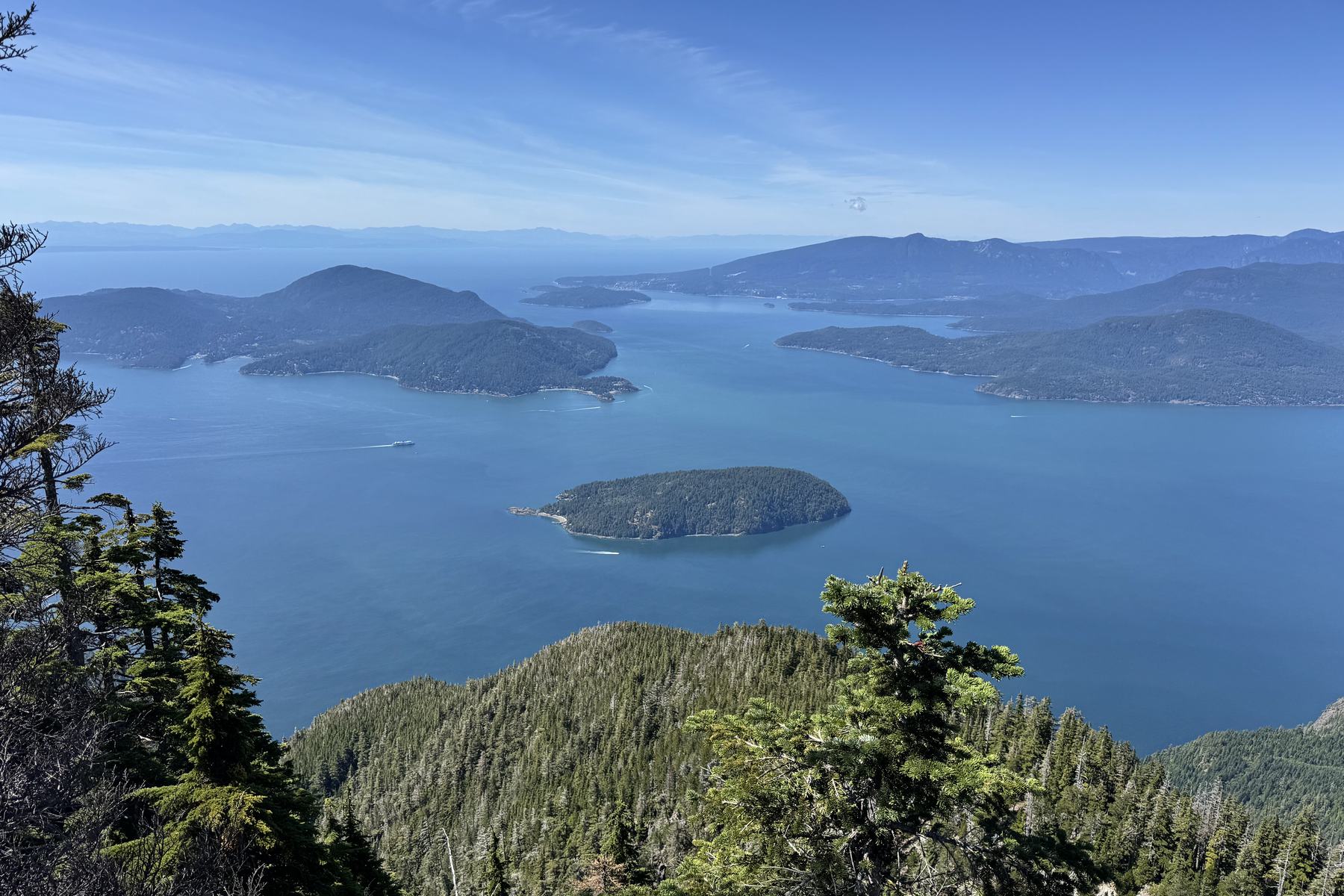 Forested islands on a calm blue sea in summer